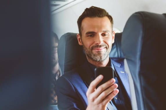 man sitting on plane